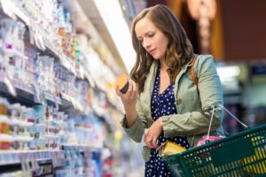 consumer looking at food label